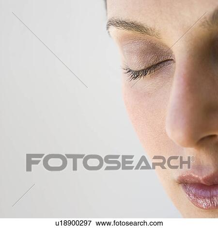 Woman’s face with eye closed View Large Photo Image Stock Photo - Woman’s face with eye closed. Fotosearch