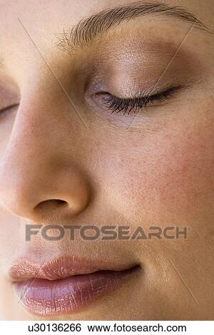Woman’s face with eyes closed View Large Photo Image Stock Photograph - Woman’s face with eyes closed. Fotosearch