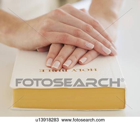 Woman's hands on Bible View Large Photo Image Stock Image - Woman's hands on Bible. Fotosearch