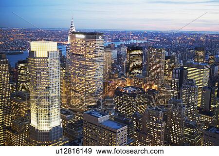 Aerial view of New York City at dusk View Large Photo Image Stock Photo - Aerial view of New York City at dusk. Fotosearch