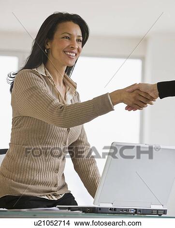 African businesswoman shaking hands View Large Photo Image Picture - African businesswoman shaking hands. Fotosearch
