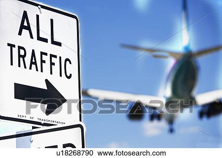 Stock Image - All traffic sign and airplane in background. Fotosearch