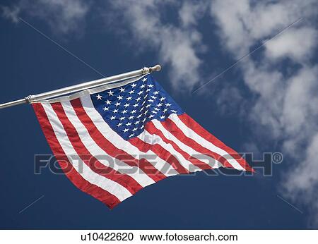 American flag under blue sky View Large Photo Image Stock Image - American flag under blue sky. Fotosearch