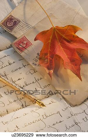Stock Photo - Autumn leaf on old-fashioned letters. Fotosearch