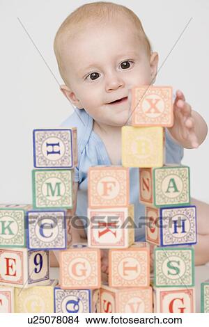 Picture - Baby playing with blocks. Fotosearch