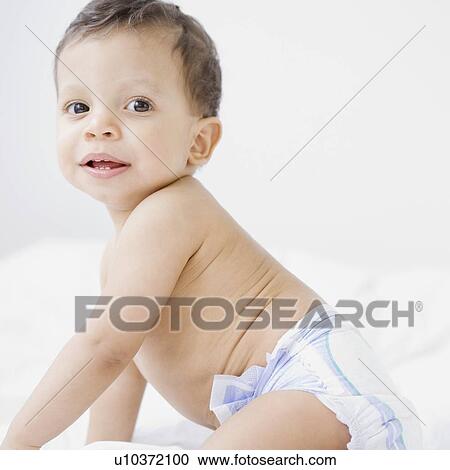 Stock Image - Baby wearing diaper. Fotosearch