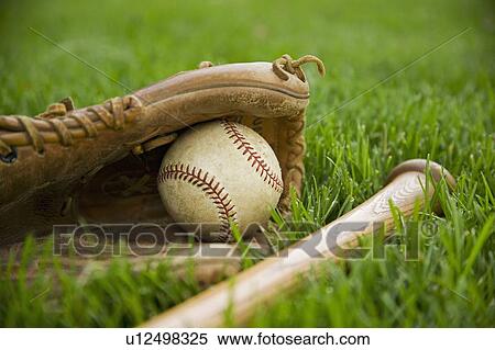 Baseball equipment laying on grass View Large Photo Image Stock Photography - Baseball equipment laying on grass. Fotosearch