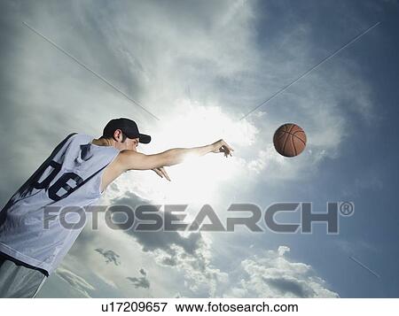 Basketball player throwing ball View Large Photo Image Stock Photo - Basketball player throwing ball. Fotosearch