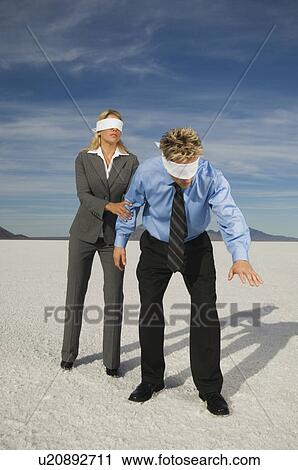 Blindfolded businesspeople on salt flats, Salt Flats, Utah, United States View Large Photo Image Stock Image - Blindfolded businesspeople on salt flats, Salt Flats, Utah, United States. Fotosearch