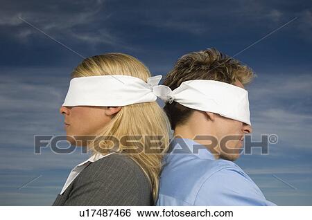 Blindfolded businesspeople standing back to back, Salt Flats, Utah, United States View Large Photo Image Stock Photograph - Blindfolded businesspeople standing back to back, Salt Flats, Utah, United States. Fotosearch