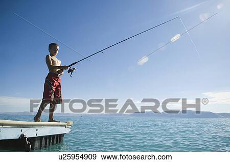 Boy fishing off dock in lake, Utah, United States View Large Photo Image Stock Photo - Boy fishing off dock in lake, Utah, United States. Fotosearch