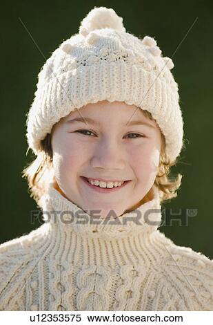 Stock Photography - Boy wearing hat and sweater. Fotosearch