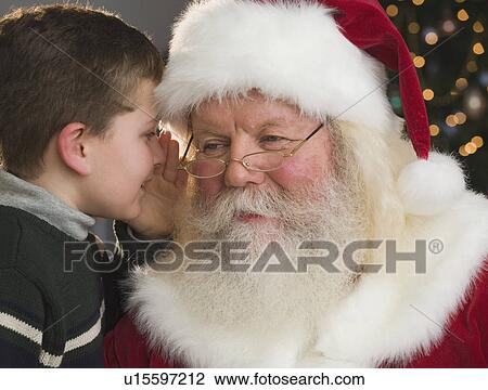Boy whispering in Santa Claus’s ear View Large Photo Image Stock Image - Boy whispering in Santa Claus’s ear. Fotosearch