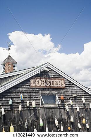 Buoys hanging on shingled building, Maine, United States View Large Photo Image Stock Photo - Buoys hanging on shingled building, Maine, United States. Fotosearch