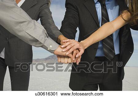 Businesspeople in huddle, Salt Flats, Utah, United States View Large Photo Image Stock Image - Businesspeople in huddle, Salt Flats, Utah, United States. Fotosearch