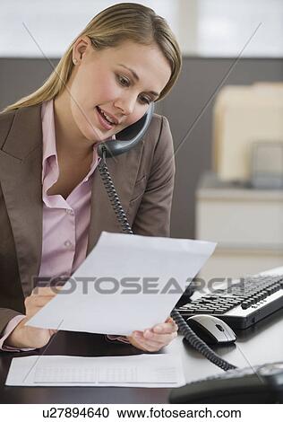 Businesswoman talking on telephone View Large Photo Image Stock Image - Businesswoman talking on telephone. Fotosearch