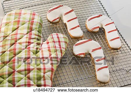 Candy cane cookies and oven mitt on cooling rack View Large Photo Image Stock Photo - Candy cane cookies and oven mitt on cooling rack. Fotosearch