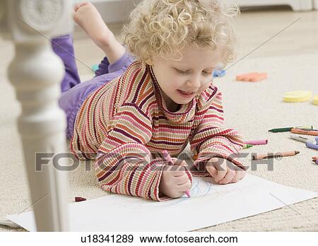 Child drawing with crayon View Large Photo Image Stock Photo - Child drawing with crayon. Fotosearch