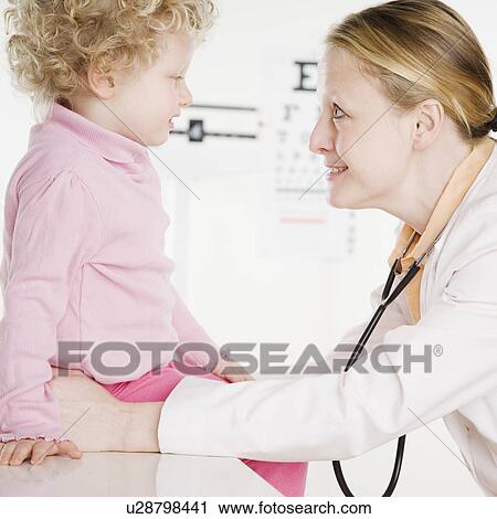 Child with pediatrician in office View Large Photo Image Stock Image - Child with pediatrician in office. Fotosearch