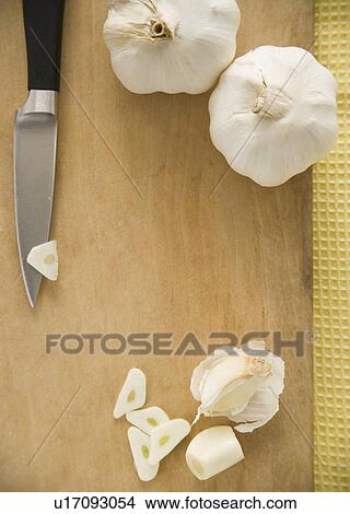 Chopped garlic on cutting board View Large Photo Image Picture - Chopped garlic on cutting board. Fotosearch