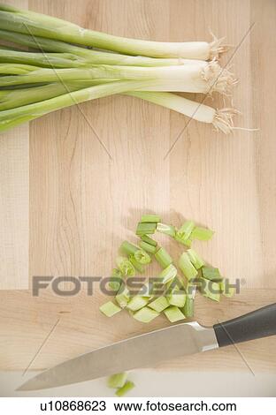 Chopped green onions on cutting board View Large Photo Image Stock Image - Chopped green onions on cutting board. Fotosearch