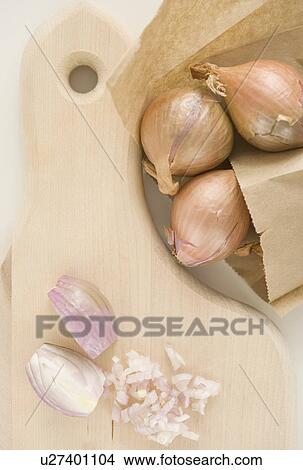 Chopped onions on cutting board View Large Photo Image Picture - Chopped onions on cutting board. Fotosearch