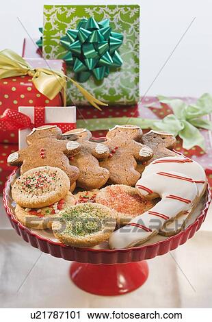 Christmas cookies in front of gifts View Large Photo Image Stock Image - Christmas cookies in front of gifts. Fotosearch