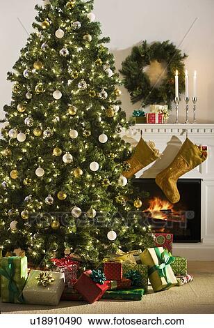 Christmas tree with gifts underneath View Large Photo Image Stock Image - Christmas tree with gifts underneath. Fotosearch