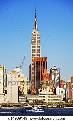 Stock Photo - City skyline along water. Fotosearch