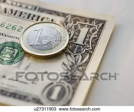 Close up euro coin and us dollar View Large Photo Image Stock Image - Close up euro coin and us dollar. Fotosearch