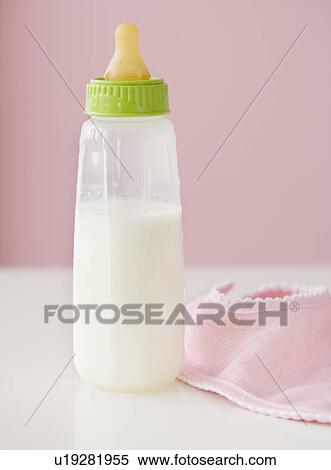 Close up of baby bottle and bib View Large Photo Image Stock Photography - Close up of baby bottle and bib. Fotosearch