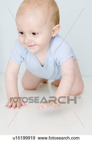 Close up of baby crawling View Large Photo Image Stock Photo - Close up of baby crawling. Fotosearch