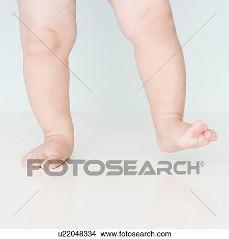 Picture - Close up of baby walking. Fotosearch