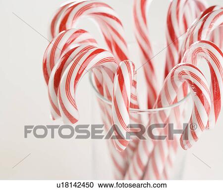 Close up of candy canes in a glass View Large Photo Image Stock Image - Close up of candy canes in a glass. Fotosearch