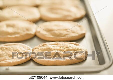 Picture - Close up of cookies on sheet pan. Fotosearch