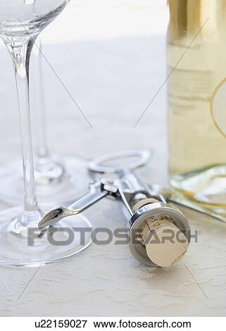 Close up of corkscrew and wine glasses View Large Photo Image Stock Photo - Close up of corkscrew and wine glasses. Fotosearch