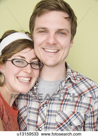 Close up of couple hugging View Large Photo Image Stock Image - Close up of couple hugging. Fotosearch
