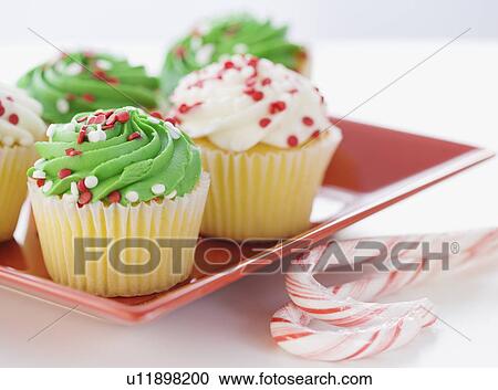Close up of cupcakes and candy canes View Large Photo Image Stock Image - Close up of cupcakes and candy canes. Fotosearch