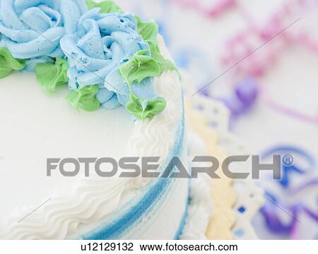 Stock Image - Close up of decorated cake. Fotosearch