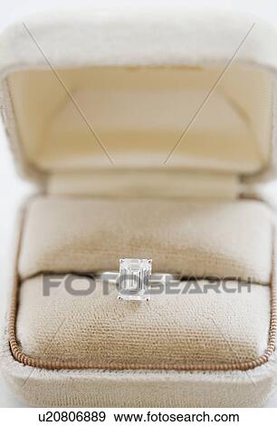 Close up of diamond engagement ring in box View Large Photo Image Stock Photo - Close up of diamond engagement ring in box. Fotosearch