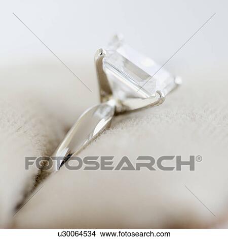 Picture - Close up of diamond engagement ring. Fotosearch