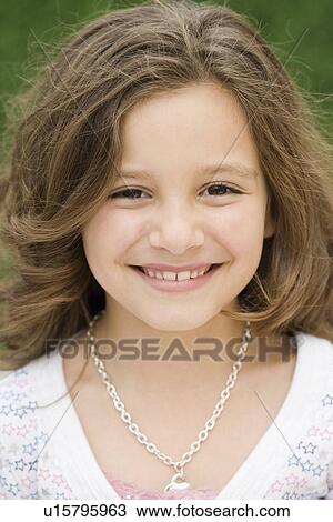 Stock Image - Close up of girl smiling. Fotosearch