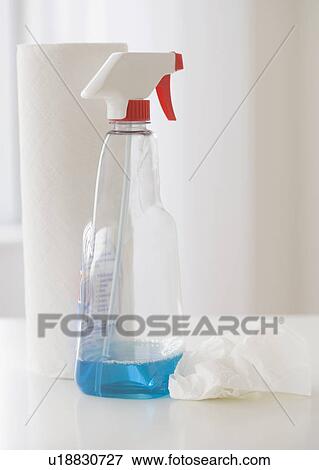 Close up of glass cleaner and paper towels View Large Photo Image Stock Photo - Close up of glass cleaner and paper towels. Fotosearch