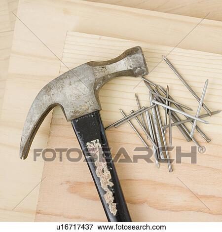 Stock Photo - Close up of hammer and nails. Fotosearch
