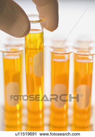 Stock Image - Close up of liquid in vials. Fotosearch