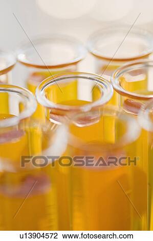 Stock Image - Close up of liquid in vials. Fotosearch