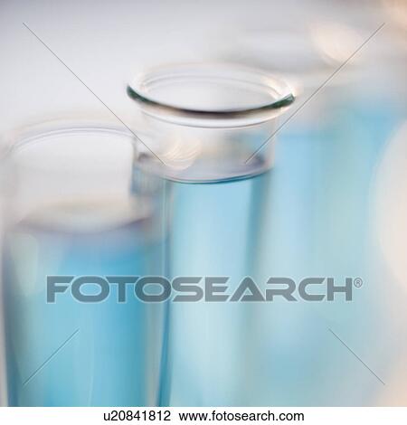 Stock Image - Close up of liquid in vials. Fotosearch