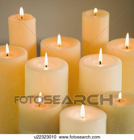 Close up of lit candles View Large Photo Image Stock Image - Close up of lit candles. Fotosearch