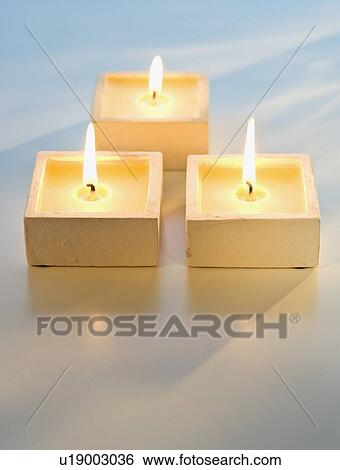 Close up of lit candles View Large Photo Image Stock Photograph - Close up of lit candles. Fotosearch