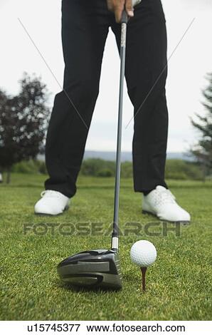 Close up of man playing golf View Large Photo Image Stock Photo - Close up of man playing golf. Fotosearch